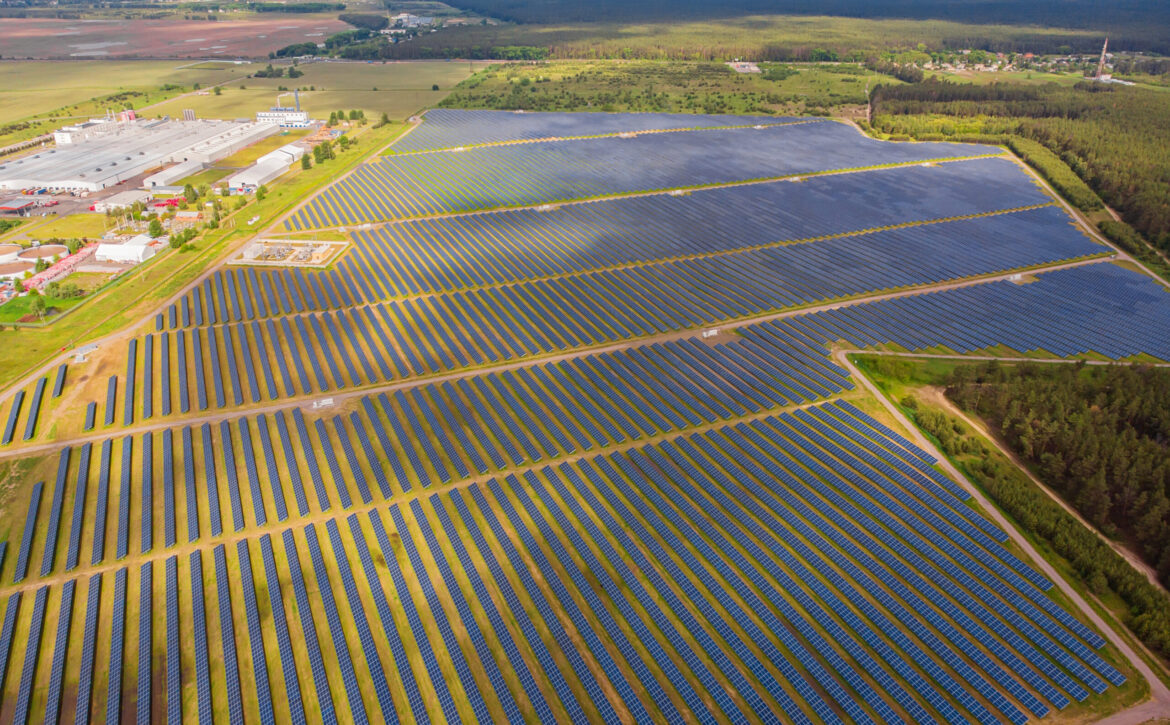 Solar power plant in the field. Aerial view of Solar panels.